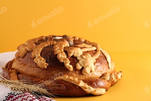 Preview: Rushnyk with korovai on yellow background. Ukrainian bread and salt welcoming tradition
