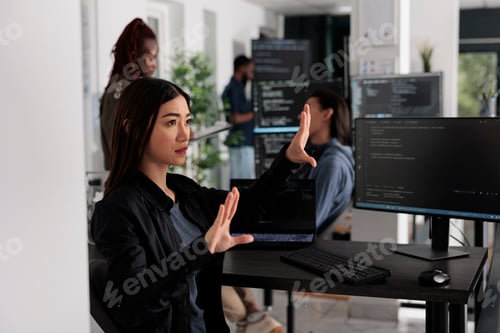 Preview: Serious system engineer working with hologram and coding language