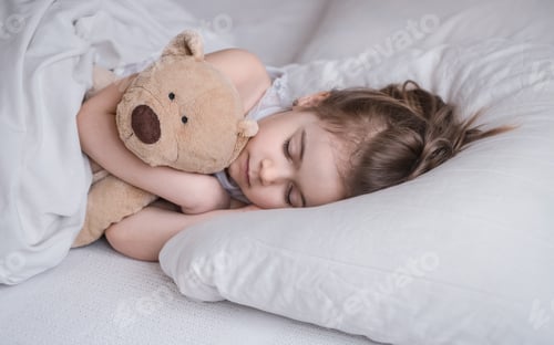Preview: Little cute girl in bed with toy