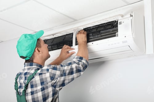 Preview: Male technician cleaning air conditioner indoors