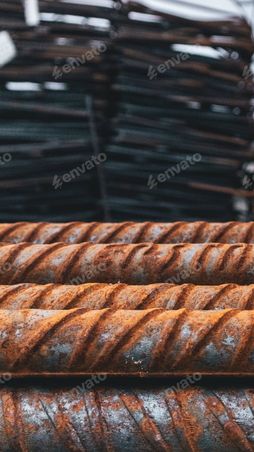 Preview: Selective focus shot of rusty pipes stacked on top of each other