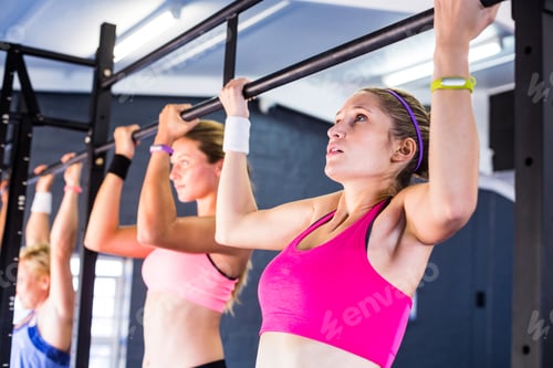 Preview: People doing chin-ups in gym