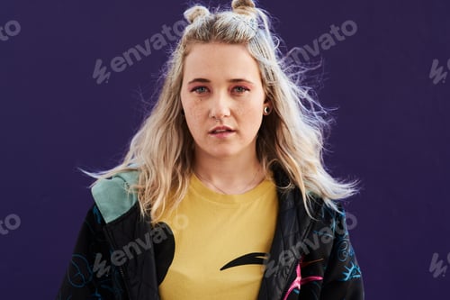 Preview: Cropped shot of a beautiful young woman posing against a purple background