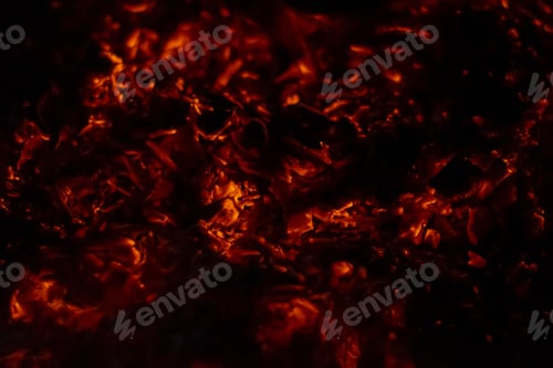 Preview: Closeup of embers of a burning log creating a fiery background