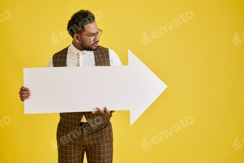 Preview: Entrepreneur Holding Huge Paper Arrow
