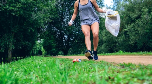 Preview: Girl with garbage bag doing plogging