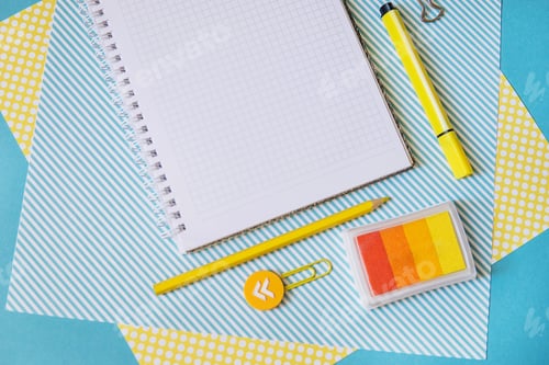 Preview: School supplies. Yellow and blue colors. Empty notebook. Flat lay composition. Space for text.