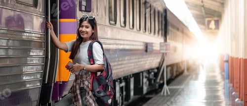 Preview: Portrait attraction asian woman boarding a train at train station for travel in summer. Travel