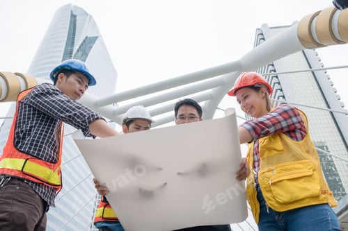 Preview: Engineer group with businessman partner meeting and pointing to blueprint for big project