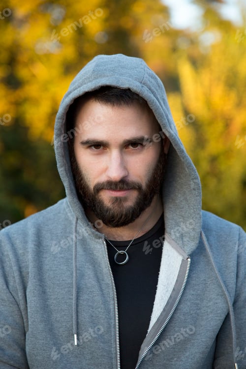 Preview: portrait of bearded Caucasian man in outdoor hooded sportswear
