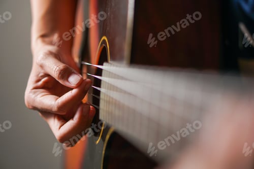Preview: Man playing acoustic guitar
