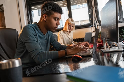 Preview: Group of casual team workers and programmers working on a new project