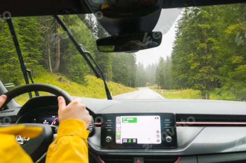 Preview: Tourist drives car through pass in Alps