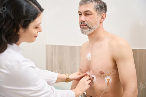 Preview: Nurse putting sensors before procedure in the clinic