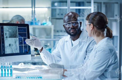 Preview: Scientists working with computer in team