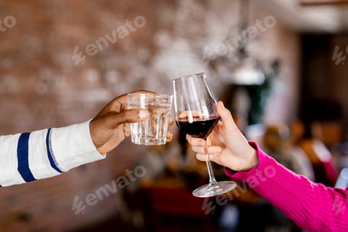 Preview: Clinking glasses in a party