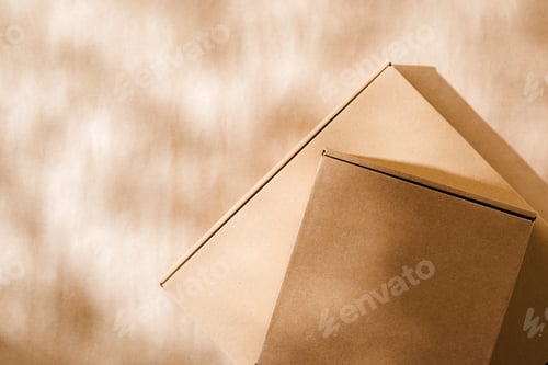 Preview: Stacked cardboard boxes on a neutral background in a shipping or packaging setting