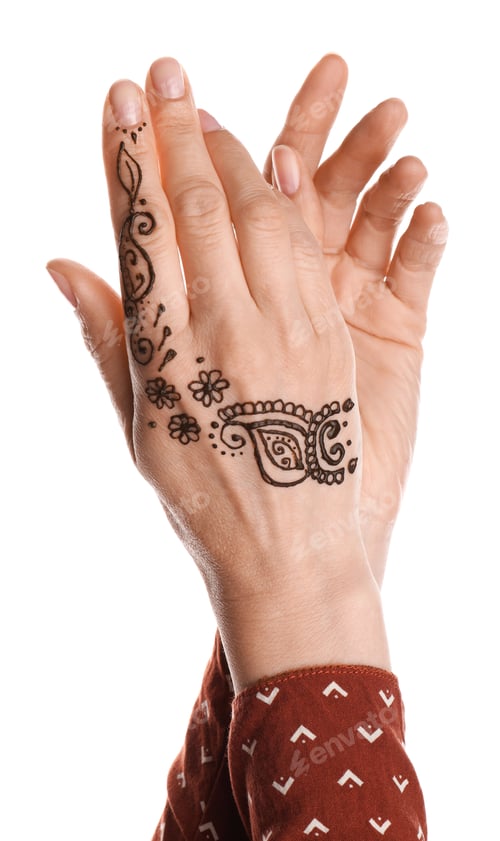 Preview: Woman with henna tattoo on hand against white background, closeup. Traditional mehndi ornament
