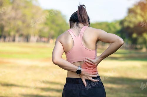 Preview: Young fitness woman holding her sports injury body, muscle painful during training.