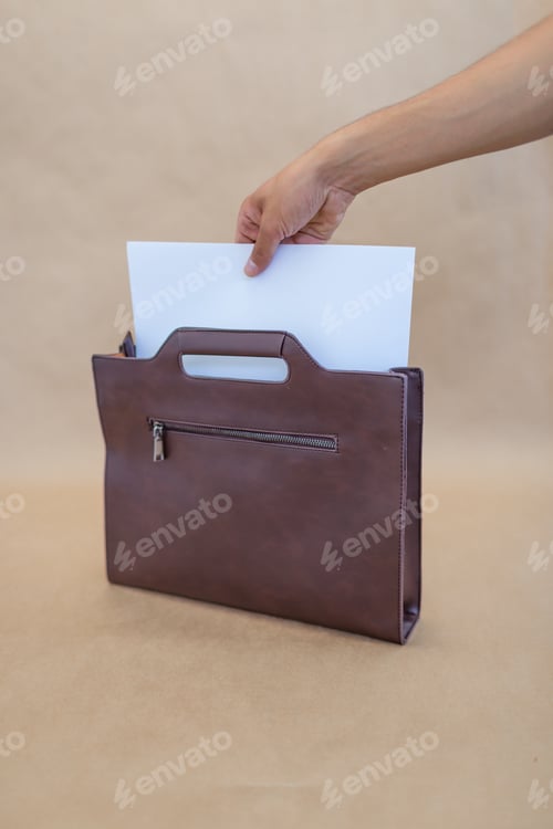 Preview: Brown leather bag on a beige background