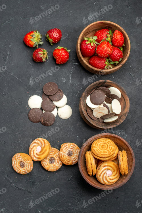 Preview: top view choco cookies with strawberries and biscuits on dark desk fruit sweet biscuit