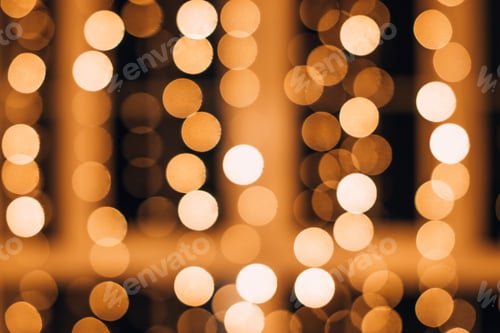 Preview: New Year and Christmas background.Blurred lights of a garland.Festive bokeh.