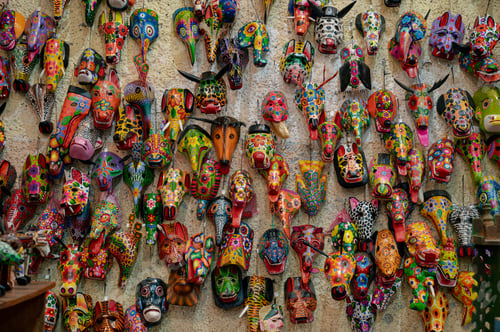 Preview: Colorful wooden masks wall in Guatemala market