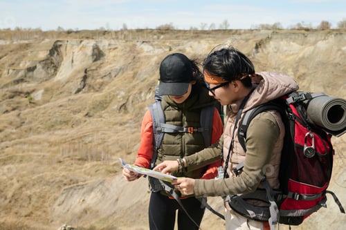 Preview: Two Women Using Paper Map