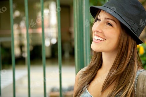 Preview: Young woman wearing hat, portrait