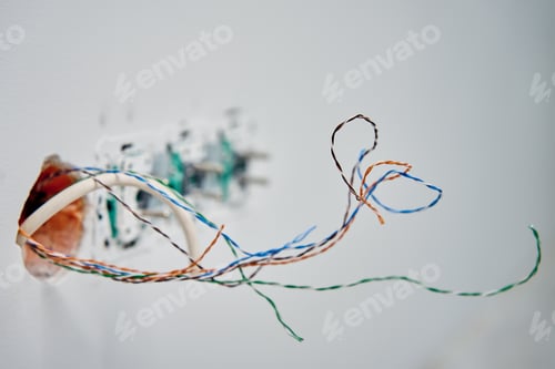 Preview: Exposed network cables in wall socket during repair