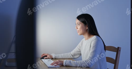 Preview: Woman work on computer at home