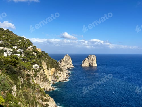 Preview: Capri island view featuring iconic Faraglioni sea stacks