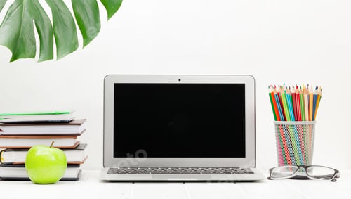Preview: Studio workspace with laptop, supplies and apple