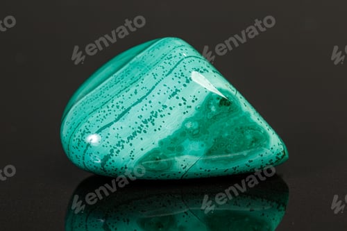 Preview: macro mineral stone malachite on a black background