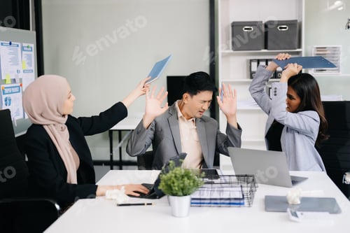 Preview: Furious businesspeople arguing strongly after making a mistake at work in office