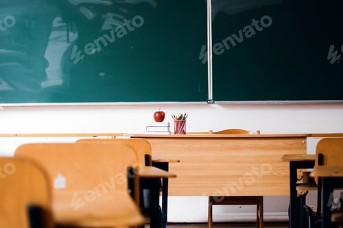 Preview: Classroom Interior with Books and Apple on Desk