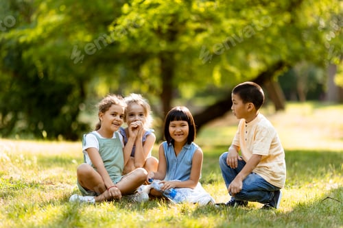 Preview: Group of asian and caucasian kids having fun in the park
