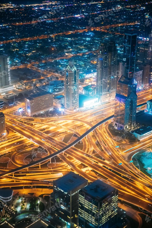 Preview: Aerial View Of Street Night Traffic Of Illuminated Cityscape With Skyscraper In Dubai. Urban