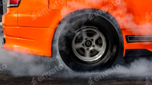 Preview: Car burnout wheels tire with white smoke,Car wheel burnout with smoke from the spinning tyre.
