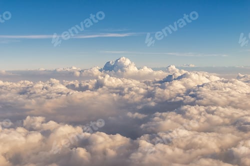 Preview: aerial view of clouds over the blue sky, a view from airplane window