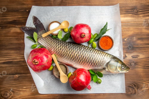 Preview: top view fresh fish with pomegranates on brown desk food seafood dish ocean