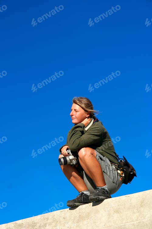 Preview: Female photographer waiting for a shot