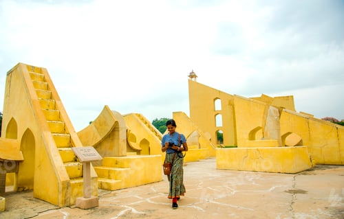 Preview: Woman tourist at the Jantar Mantar observatory, Jaipur, UNESCO World Heritage Site, India.