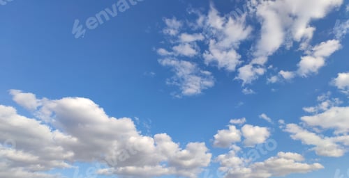Preview: Wide banner blue sky and white fluffy clouds.