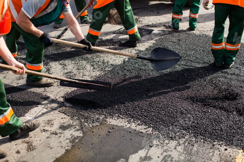 Preview: Workers on Asphalting paver machine during Road street repairing works. Street resurfacing. Fresh