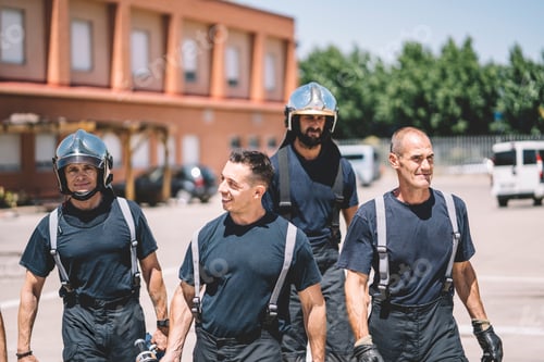 Preview: Firemen walking at fire station.