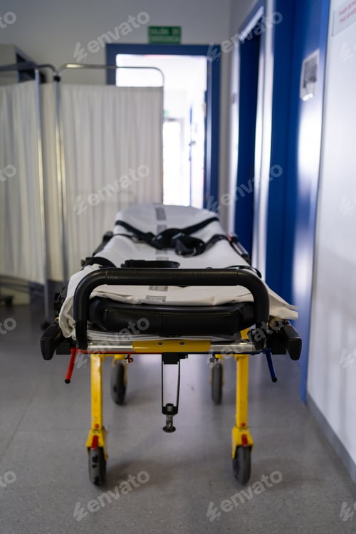 Preview: Empty stretcher waiting in hospital hallway
