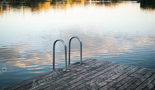 Preview: Swimming rails on the lake, wooden masonry by the river, landscape.