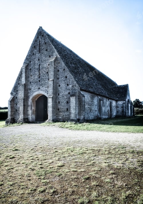 Preview: Historic stone barn under blue sky
