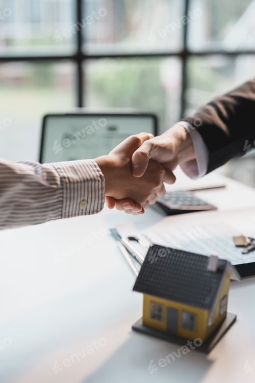 Preview: Real estate agent has entered into a contract to sell the house to the customer handshake congratula